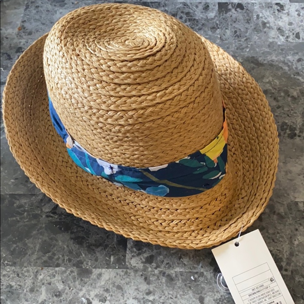 Straw hat with floral ribbon.